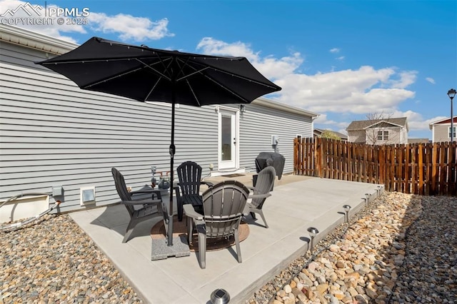 view of patio with fence