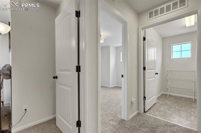 6775 Hazel Branch Ct, Colorado Springs, CO 80927 - hallway with baseboards, visible vents, and carpet flooring