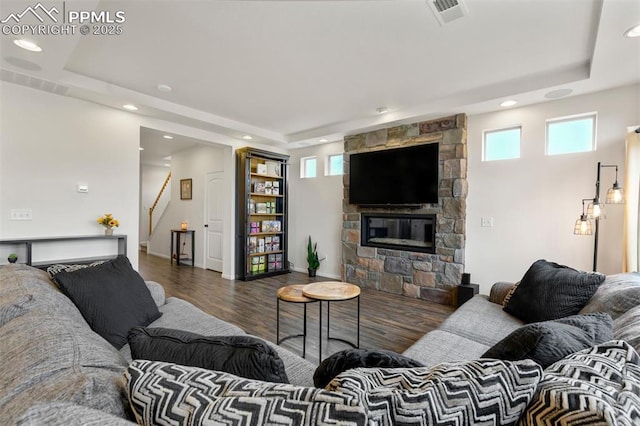 6775 Hazel Branch Ct, Colorado Springs, CO 80927 - living room featuring visible vents, a raised ceiling, and plenty of natural light