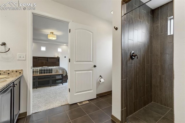 6775 Hazel Branch Ct, Colorado Springs, CO 80927 - bathroom with tile patterned floors, tiled shower, and a healthy amount of sunlight