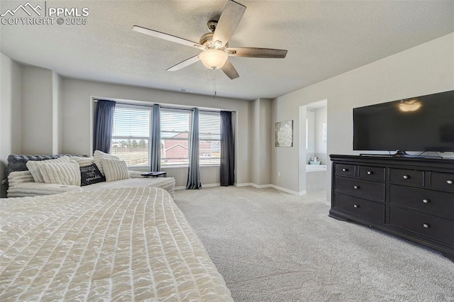 bedroom with connected bathroom, ceiling fan, light carpet, a textured ceiling, and baseboards