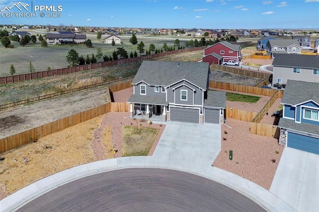 birds eye view of property with a residential view
