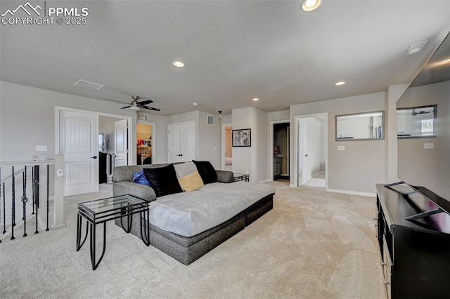 living room with a ceiling fan, visible vents, light carpet, and recessed lighting