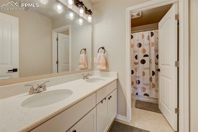 full bathroom featuring double vanity, a sink, tile patterned floors, and visible vents