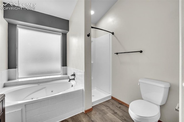 full bathroom featuring a stall shower, wood finished floors, toilet, a jetted tub, and baseboards