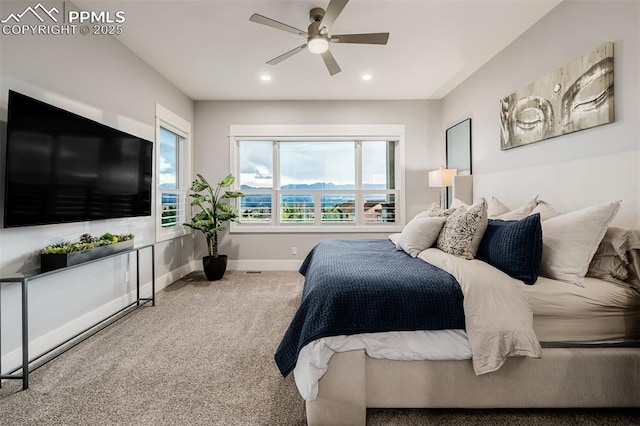 carpeted bedroom with recessed lighting, multiple windows, ceiling fan, and baseboards