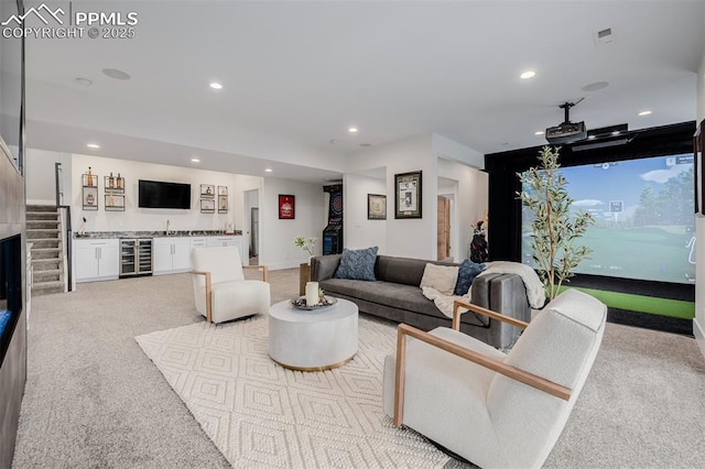 living room featuring recessed lighting, visible vents, light carpet, and beverage cooler