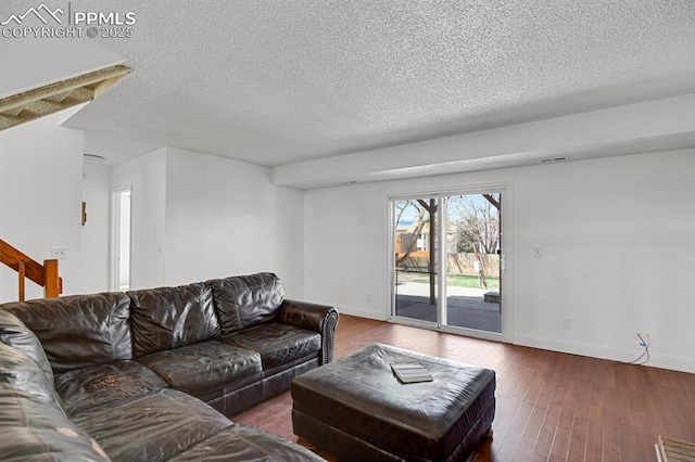 3925 Zurich Dr, Colorado Springs, CO 80920 - living room with a textured ceiling, baseboards, and wood finished floors