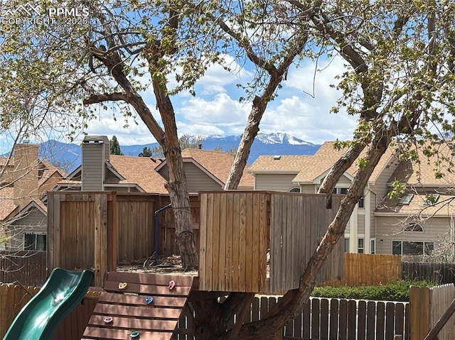 3925 Zurich Dr, Colorado Springs, CO 80920 - view of yard featuring fence, a mountain view, and a playground