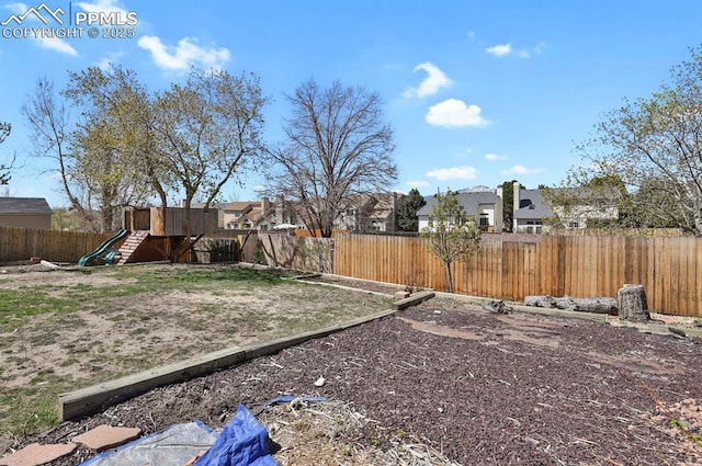 3925 Zurich Dr, Colorado Springs, CO 80920 - fenced backyard featuring a playground and a residential view