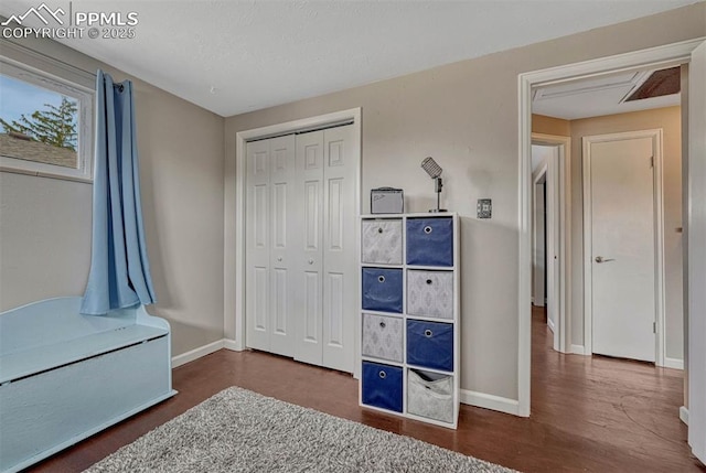 5477 E Asbury Ave, Denver, CO 80222 - bedroom with baseboards, a closet, and wood finished floors