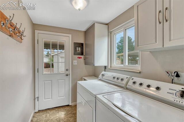 5477 E Asbury Ave, Denver, CO 80222 - laundry room featuring washing machine and dryer, cabinet space, and baseboards