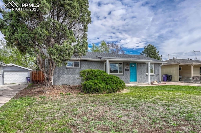 5477 E Asbury Ave, Denver, CO 80222 - ranch-style house featuring an outbuilding, brick siding, and a garage