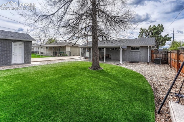 5477 E Asbury Ave, Denver, CO 80222 - back of house with a patio area, brick siding, and central AC unit