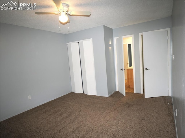 unfurnished bedroom featuring a textured ceiling, ceiling fan, a closet, and carpet floors