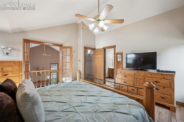 14560 Spiritwood Loop, Elbert, CO 80106 - bedroom with baseboards, wood finished floors, and high vaulted ceiling