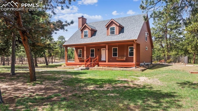 rustic home with fence, a shingled roof, a porch, a front yard, and a chimney