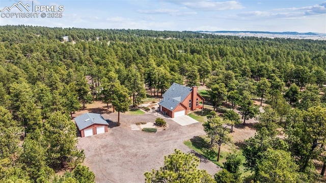 bird's eye view featuring a forest view
