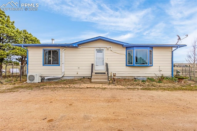 24160 Scott Rd, Calhan, CO 80808 - view of front of house with fence, ac unit, and entry steps