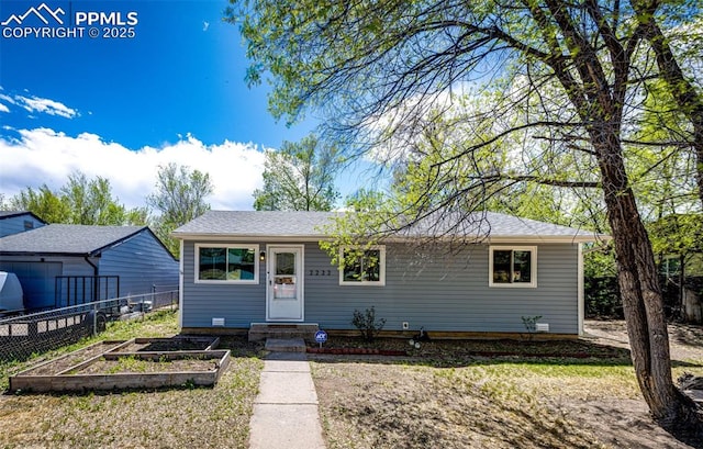 2222 Frontier Dr, Colorado Springs, CO 80911 - view of front facade featuring fence and a garden