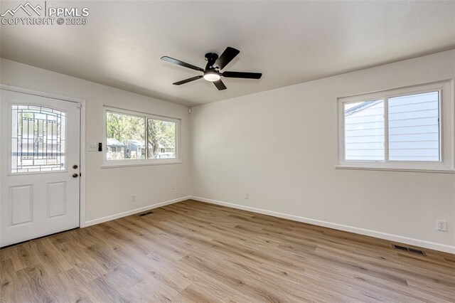 2222 Frontier Dr, Colorado Springs, CO 80911 - foyer entrance featuring baseboards, visible vents, ceiling fan, and light wood finished floors