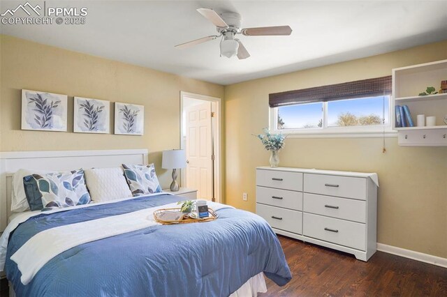 bedroom with dark wood-type flooring, baseboards, and ceiling fan