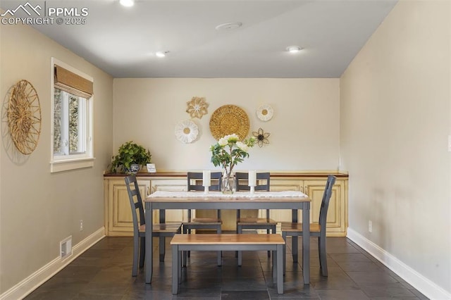 dining area featuring visible vents, recessed lighting, baseboards, and dark tile patterned floors
