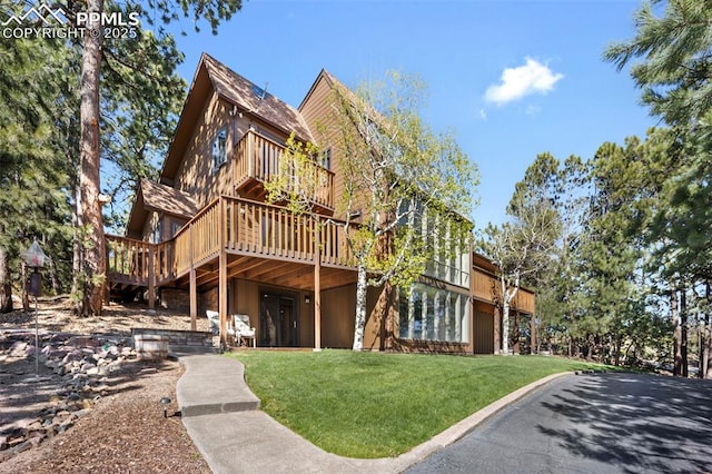 13435 Darr Dr, Colorado Springs, CO 80908 - view of front of house with a front lawn and a deck