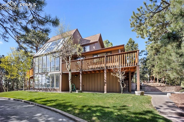 13435 Darr Dr, Colorado Springs, CO 80908 - back of house featuring a deck, a yard, and board and batten siding