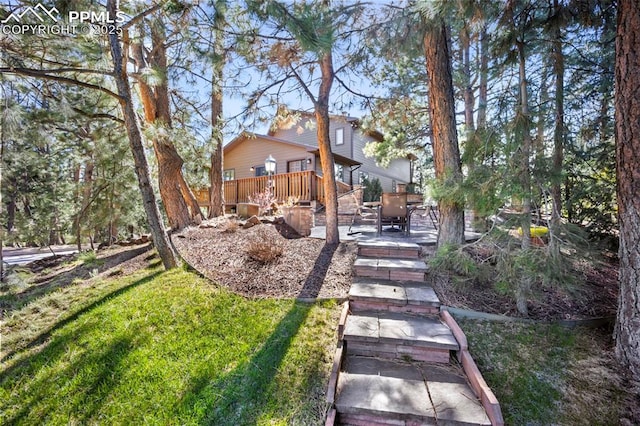 13435 Darr Dr, Colorado Springs, CO 80908 - view of yard with a wooden deck and a patio