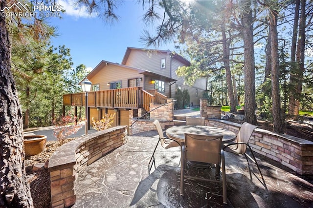 13435 Darr Dr, Colorado Springs, CO 80908 - view of patio / terrace with outdoor dining space, a wooden deck, and stairs