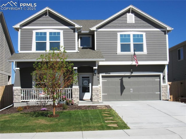 8766 Beaverhead Cir, Colorado Springs, CO 80908 - craftsman-style house featuring a porch, stone siding, a garage, a front lawn, and concrete driveway