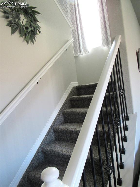 8766 Beaverhead Cir, Colorado Springs, CO 80908 - stairway with baseboards