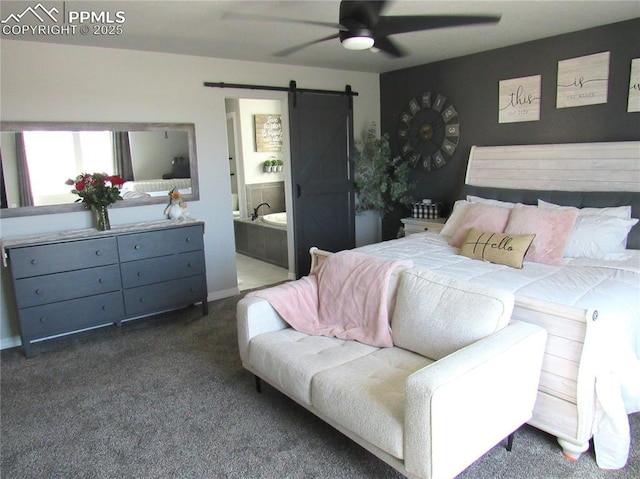 8766 Beaverhead Cir, Colorado Springs, CO 80908 - bedroom featuring a barn door, dark carpet, connected bathroom, and a ceiling fan