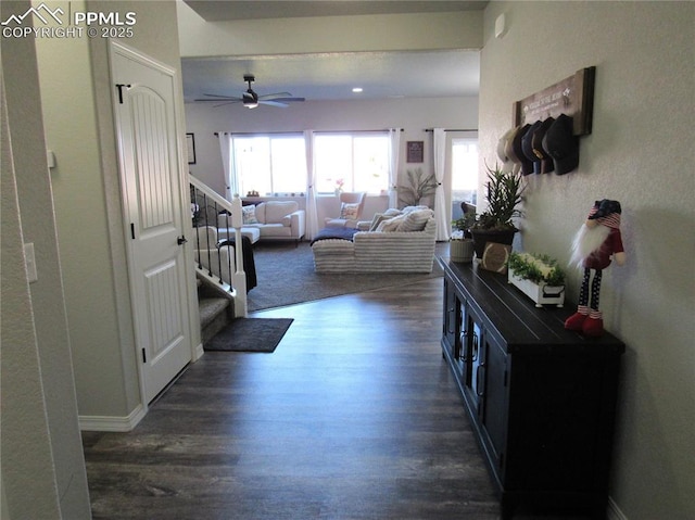 8766 Beaverhead Cir, Colorado Springs, CO 80908 - corridor featuring dark wood-type flooring, stairs, and baseboards