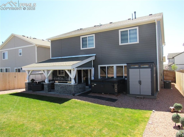 8766 Beaverhead Cir, Colorado Springs, CO 80908 - rear view of house featuring central air condition unit, a patio area, and a hot tub