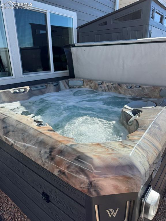 8766 Beaverhead Cir, Colorado Springs, CO 80908 - view of swimming pool with a hot tub