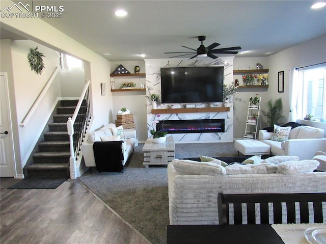 8766 Beaverhead Cir, Colorado Springs, CO 80908 - living room featuring stairway, wood finished floors, a ceiling fan, a fireplace, and recessed lighting