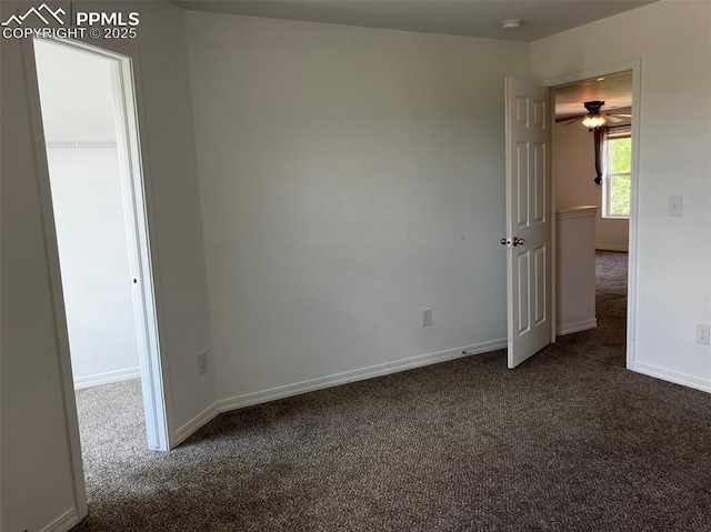 2790 Winterbourne St, Colorado Springs, CO 80910 - unfurnished room with dark carpet, baseboards, ceiling fan, and a smoke detector