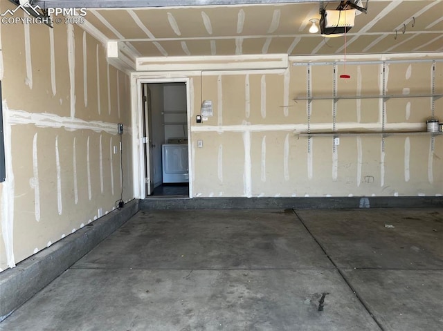 2790 Winterbourne St, Colorado Springs, CO 80910 - garage featuring a garage door opener and washer / dryer