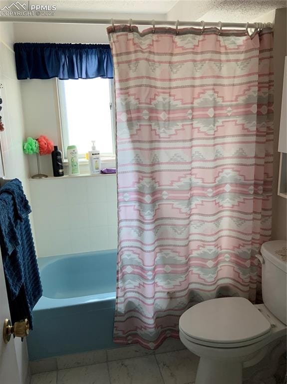 6905 Chippewa Rd, Colorado Springs, CO 80915 - full bath with toilet, marble look tile flooring, and shower / bathtub combination with curtain