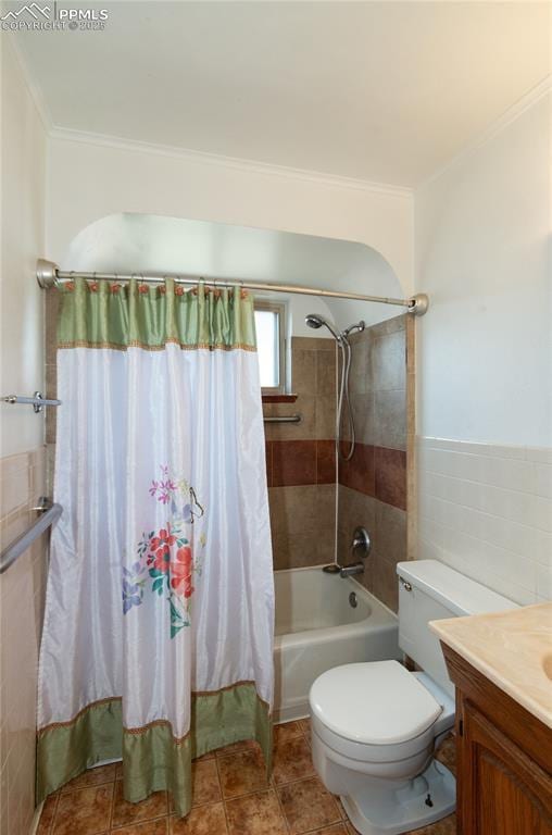 bathroom featuring vanity, toilet, tile walls, shower / tub combo, and ornamental molding