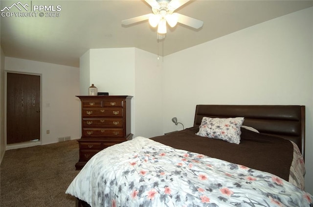 bedroom with visible vents, a ceiling fan, and carpet