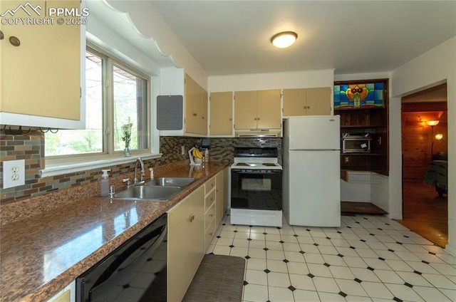 kitchen featuring a sink, electric range oven, freestanding refrigerator, black dishwasher, and under cabinet range hood