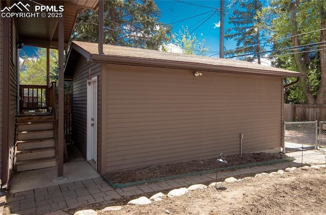 view of property exterior featuring fence