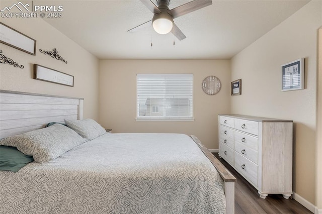 bedroom with dark wood-style flooring, baseboards, and a ceiling fan