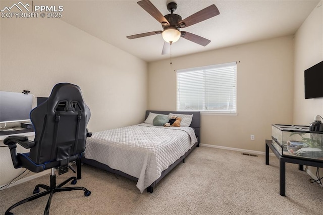 carpeted bedroom featuring visible vents, a ceiling fan, and baseboards