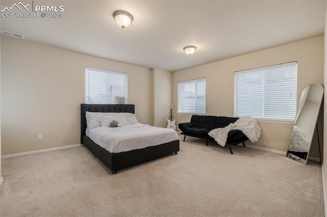 bedroom featuring carpet floors, baseboards, and visible vents