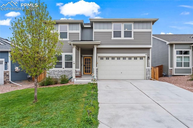 view of front of property with an attached garage, board and batten siding, driveway, and a front yard