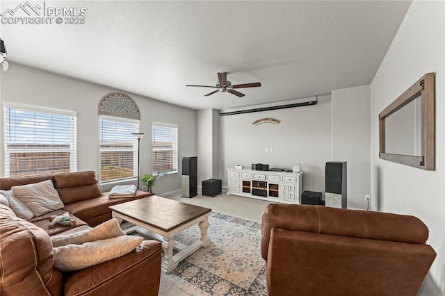 living area with carpet and a ceiling fan